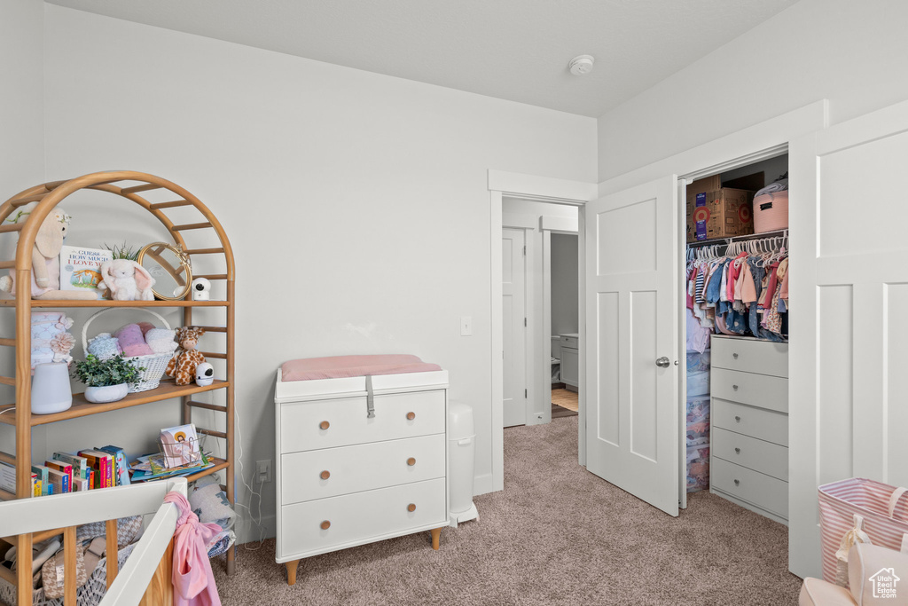 Carpeted bedroom featuring a closet