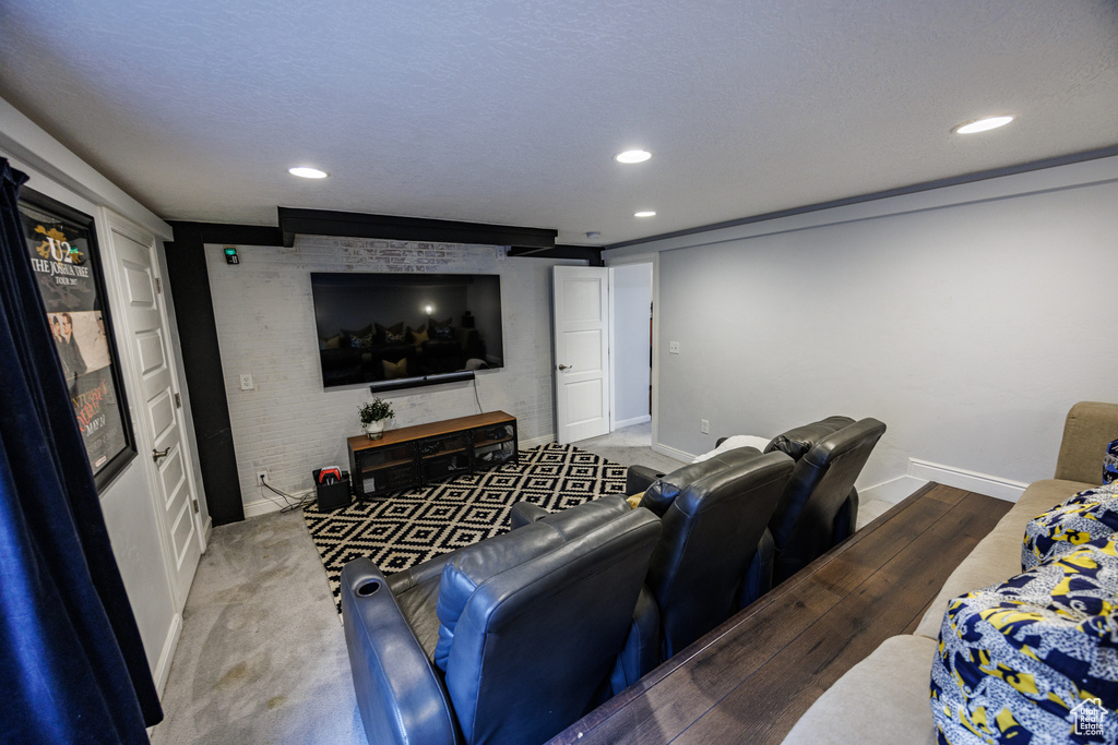 Home theater room featuring recessed lighting and baseboards