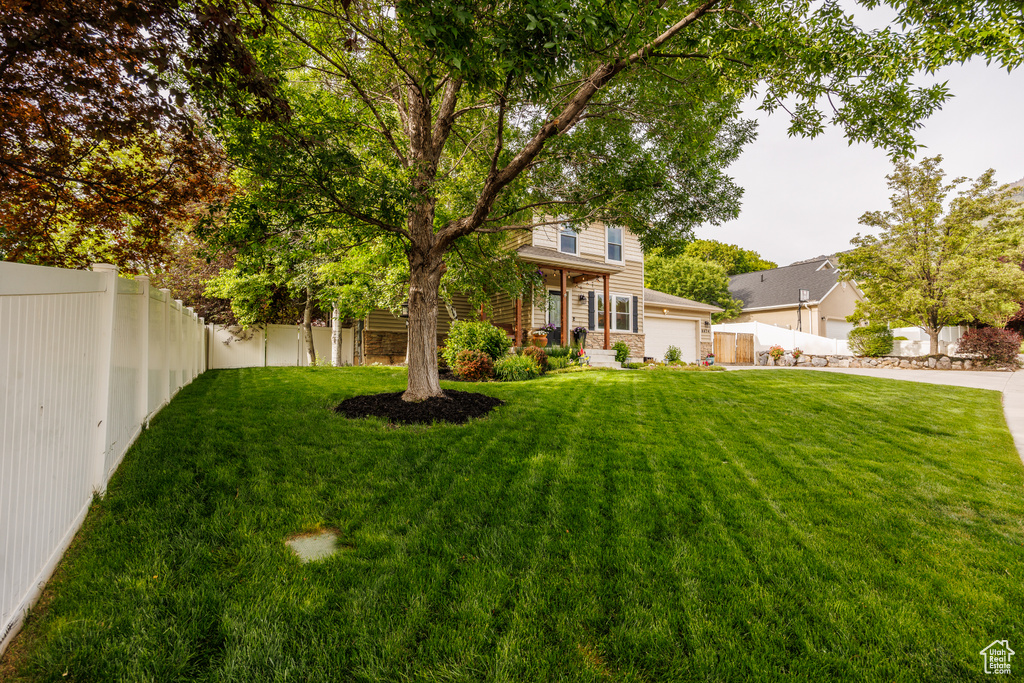 View of yard with an attached garage