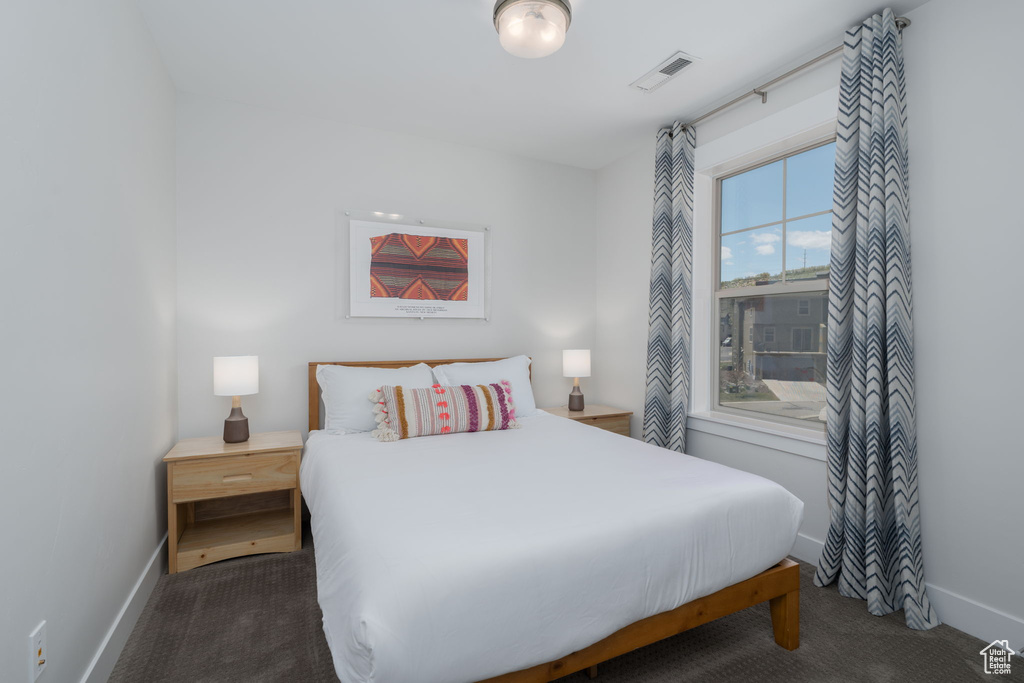 Carpeted bedroom with baseboards
