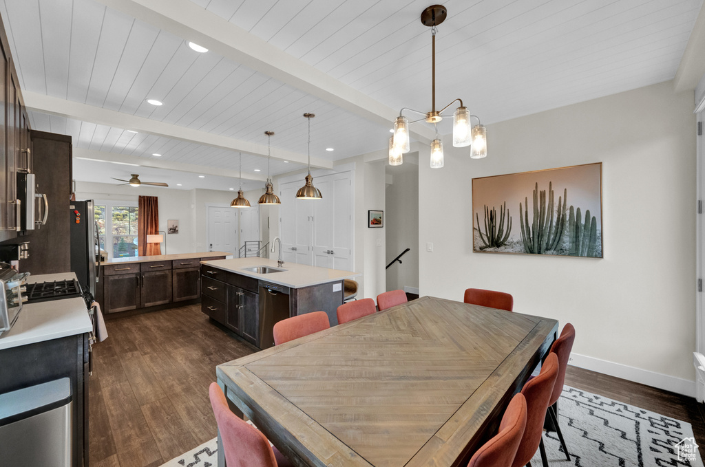 Dining room with dark wood-type flooring, baseboards, recessed lighting, wood ceiling with exposed beams, and ceiling fan
