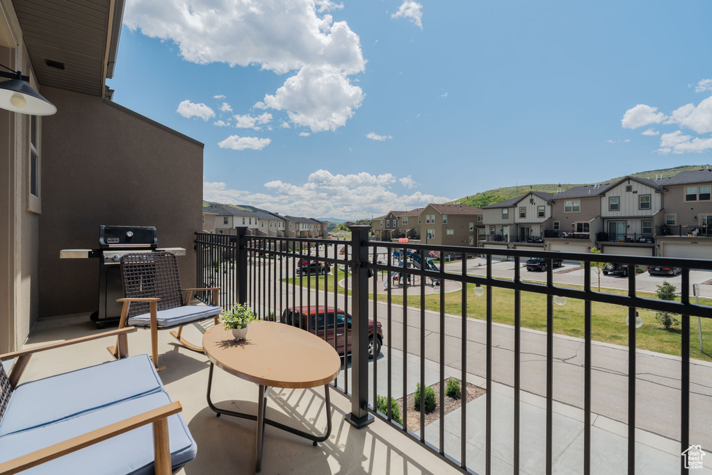 Balcony featuring a residential view and grilling area
