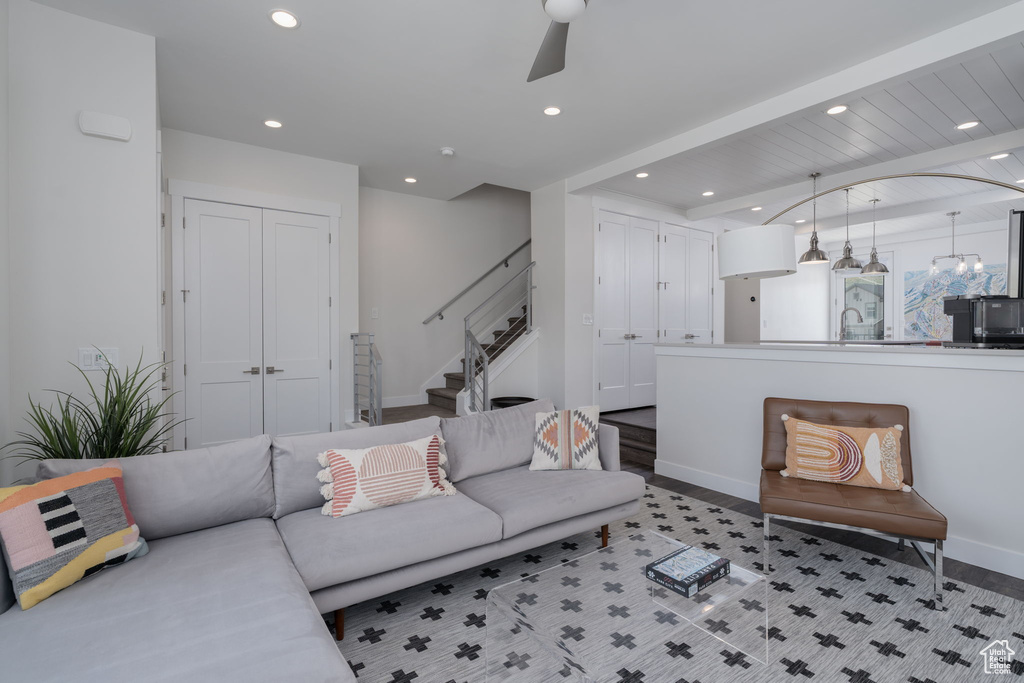Living area featuring recessed lighting, stairway, ceiling fan, light wood finished floors, and baseboards