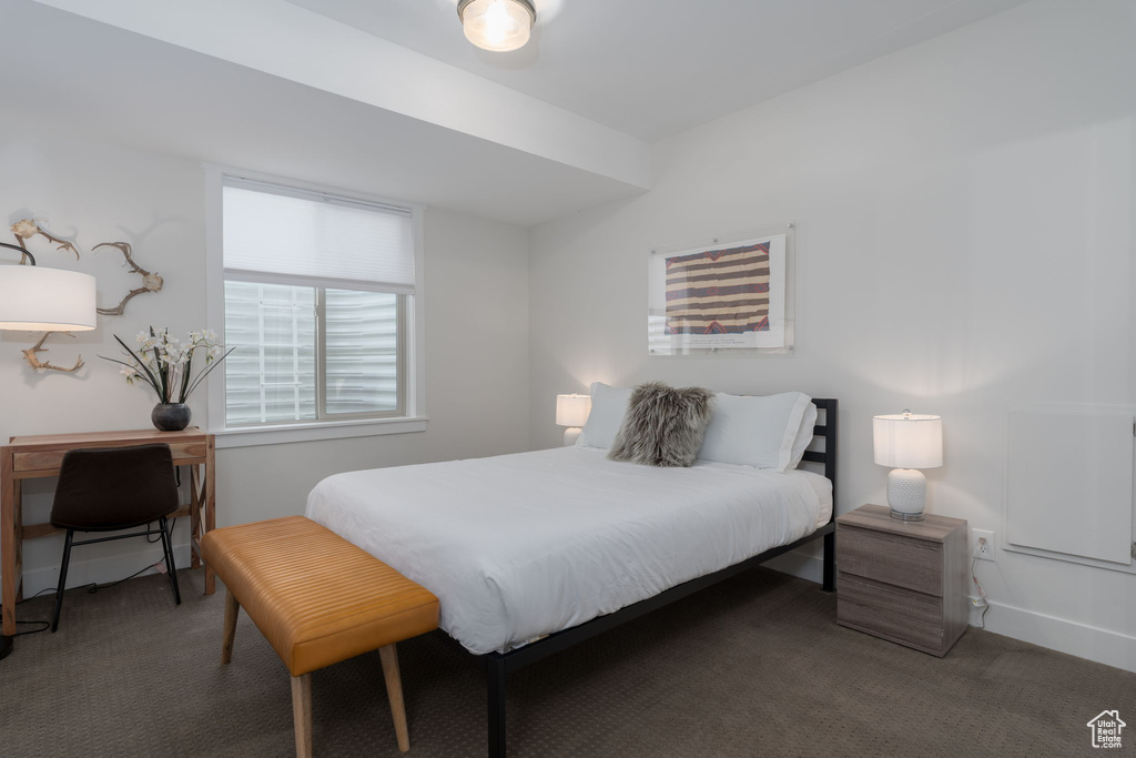 Carpeted bedroom with baseboards