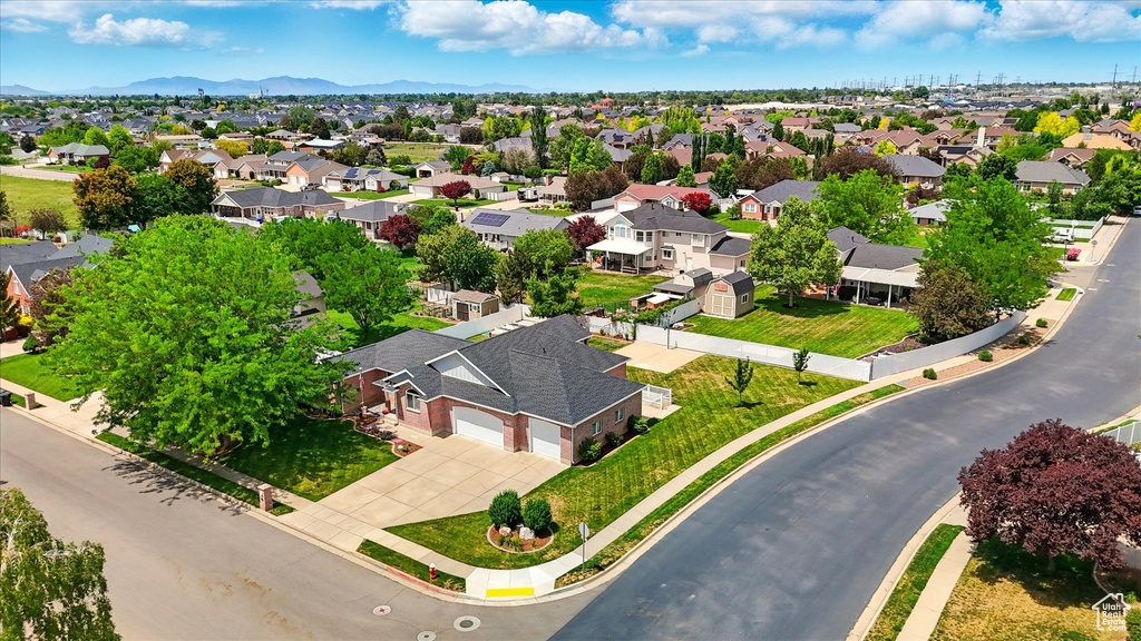 Aerial perspective of suburban area with a mountain backdrop