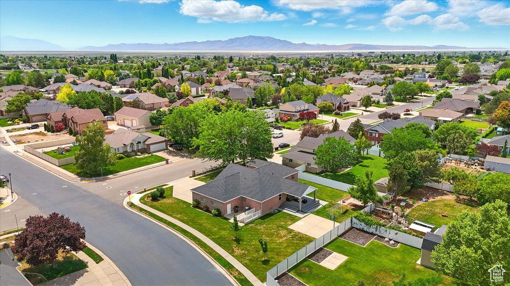 Aerial view of residential area featuring a mountain backdrop