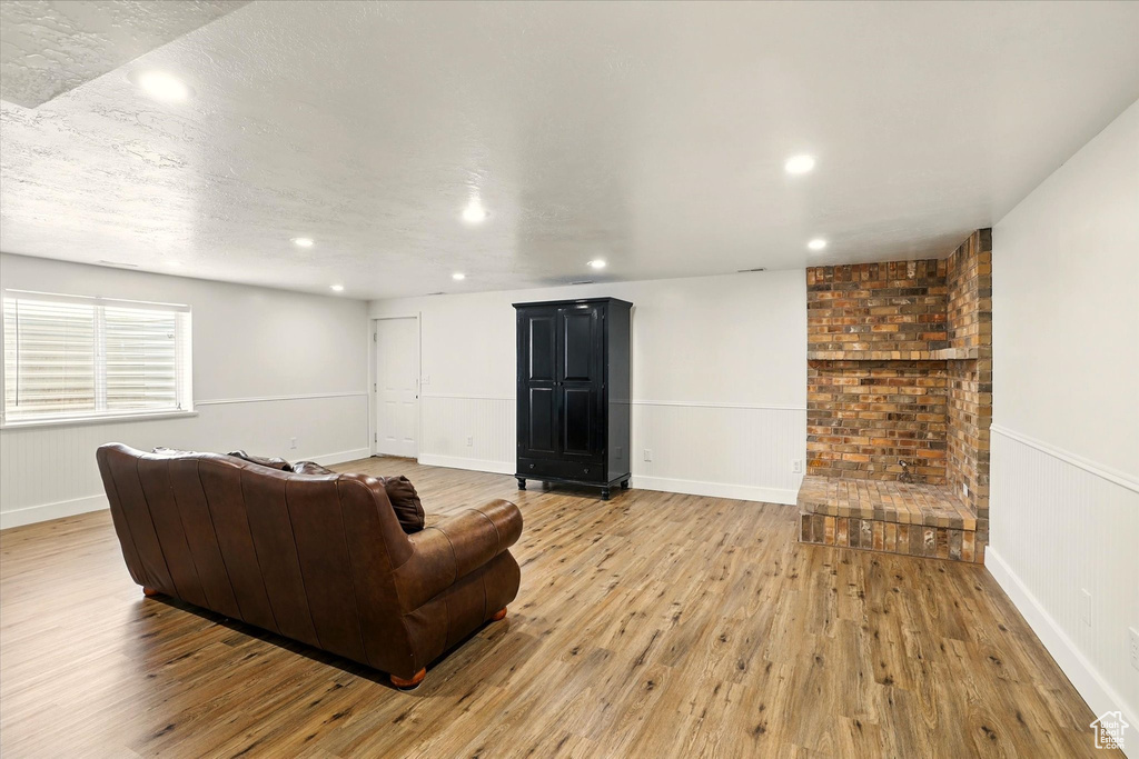 Living room featuring light wood-style floors and recessed lighting