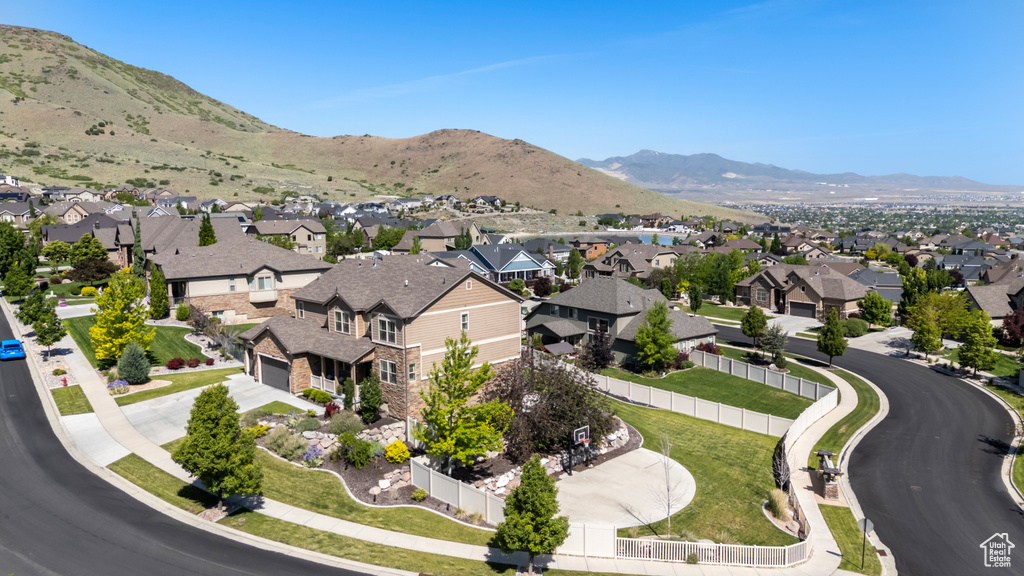 Aerial perspective of suburban area featuring a mountainous background
