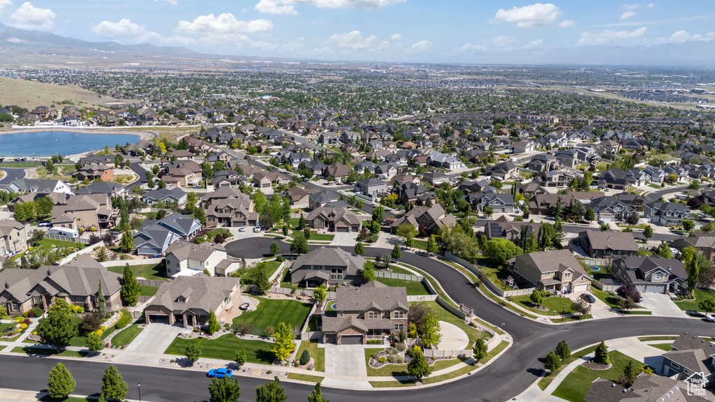 Aerial overview of property's location with nearby suburban area and mountains