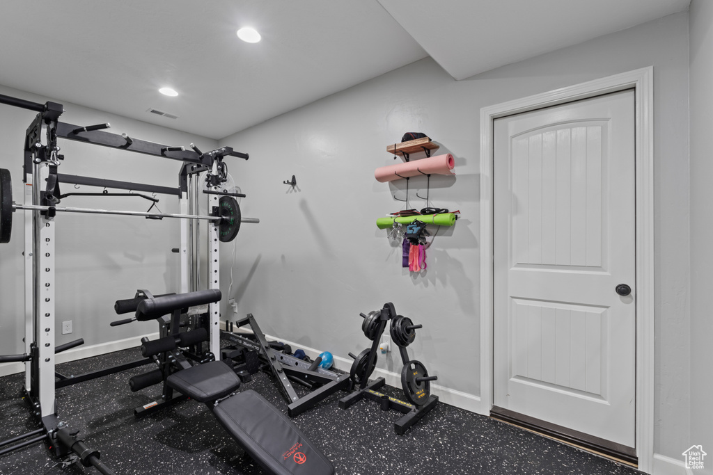 Workout room with recessed lighting and baseboards
