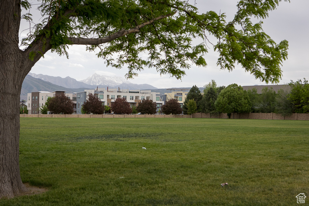 View of green lawn featuring a mountain view