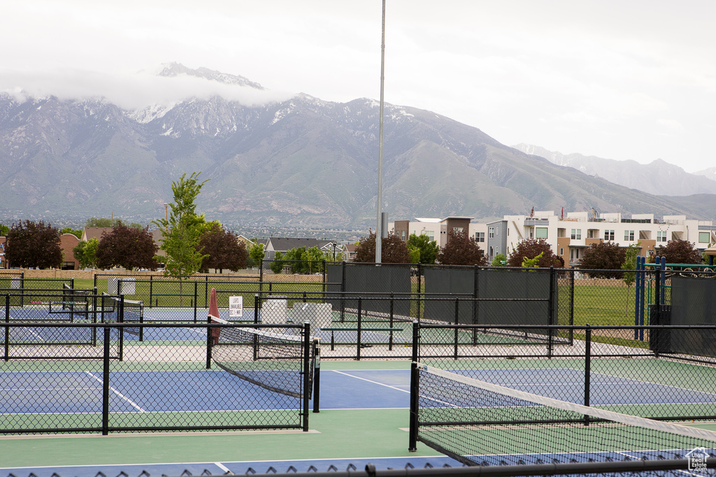 View of tennis court featuring a mountain view