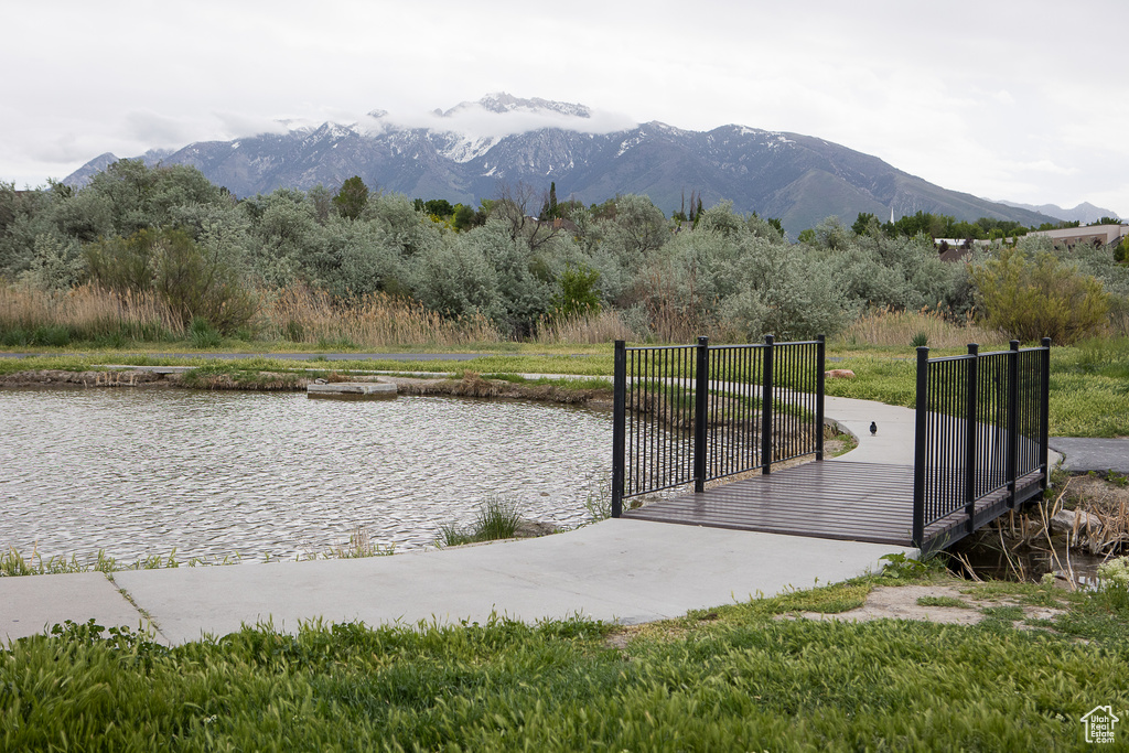 Gate featuring a water and mountain view