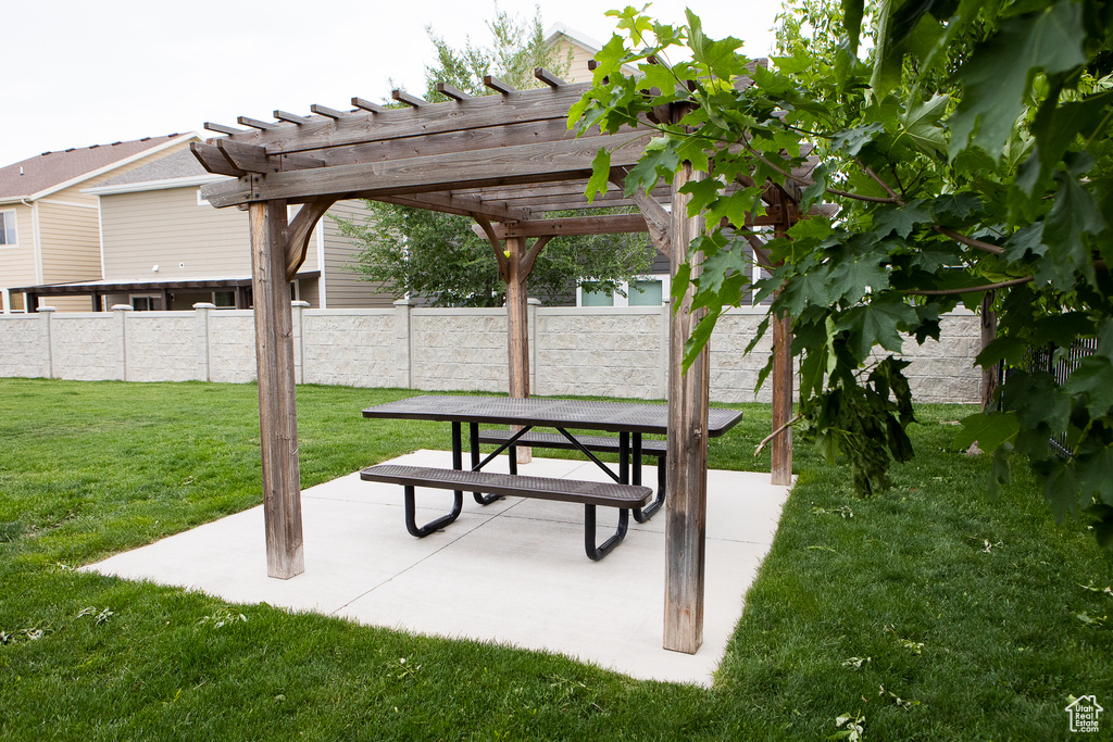 View of community featuring a pergola and a patio