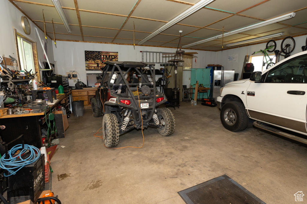 Garage with stainless steel fridge with ice dispenser