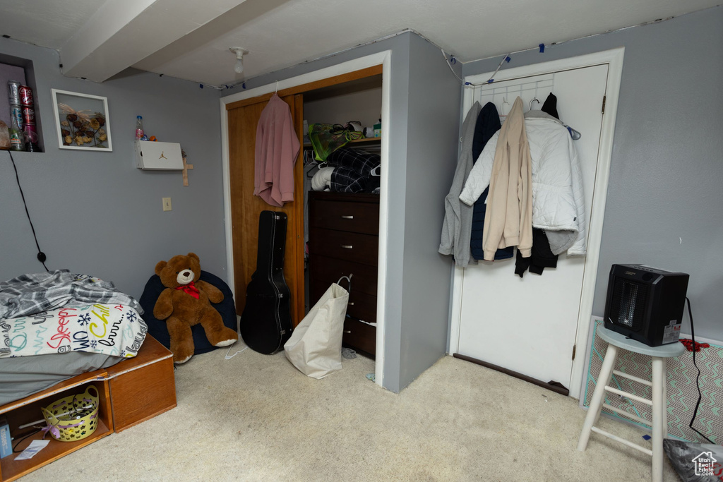 Bedroom with carpet floors and a closet