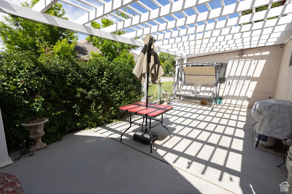 View of patio with a pergola