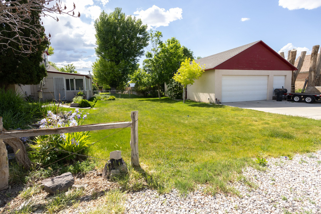 View of yard featuring a garage