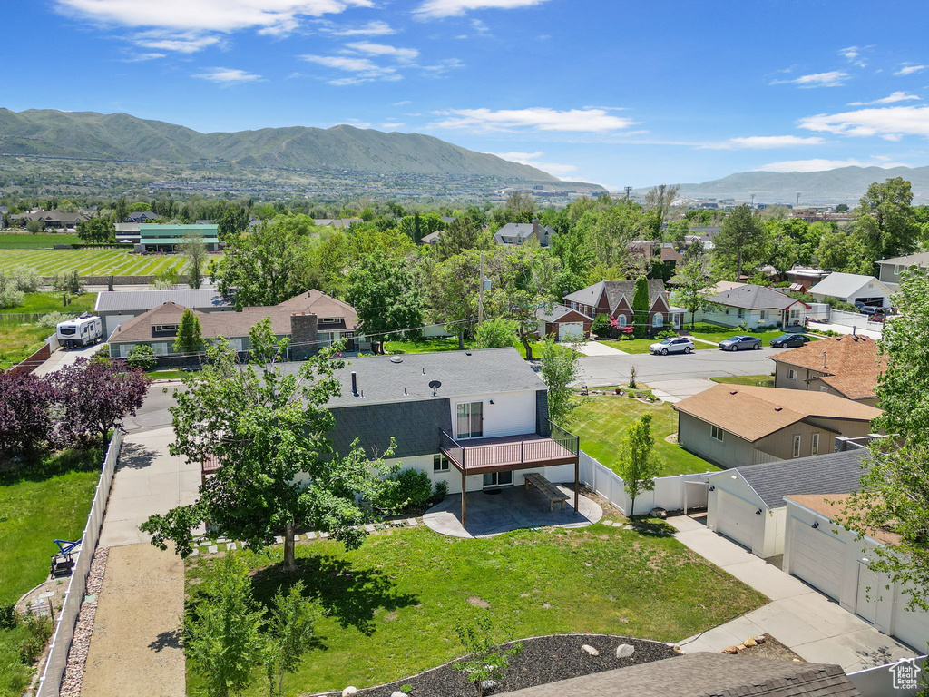 Aerial perspective of suburban area featuring a mountain backdrop