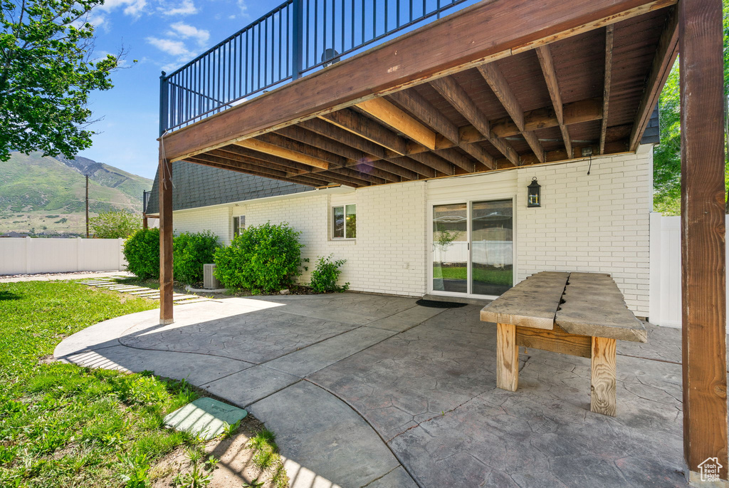 View of patio / terrace featuring a deck with mountain view