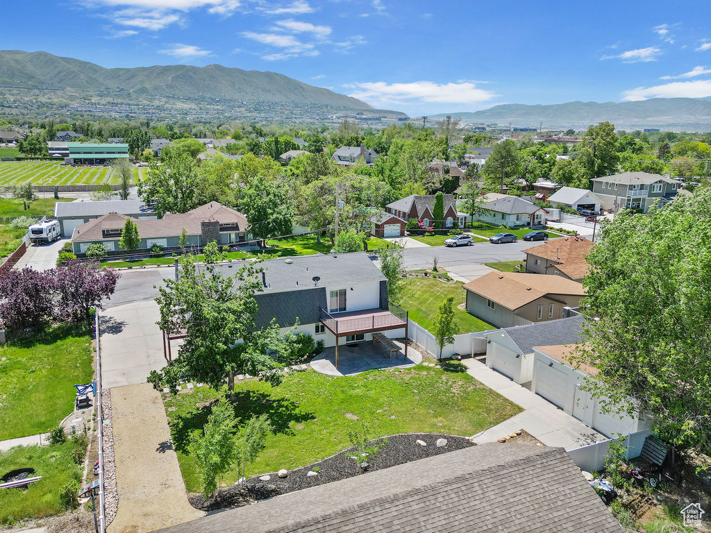 Aerial perspective of suburban area with a mountainous background