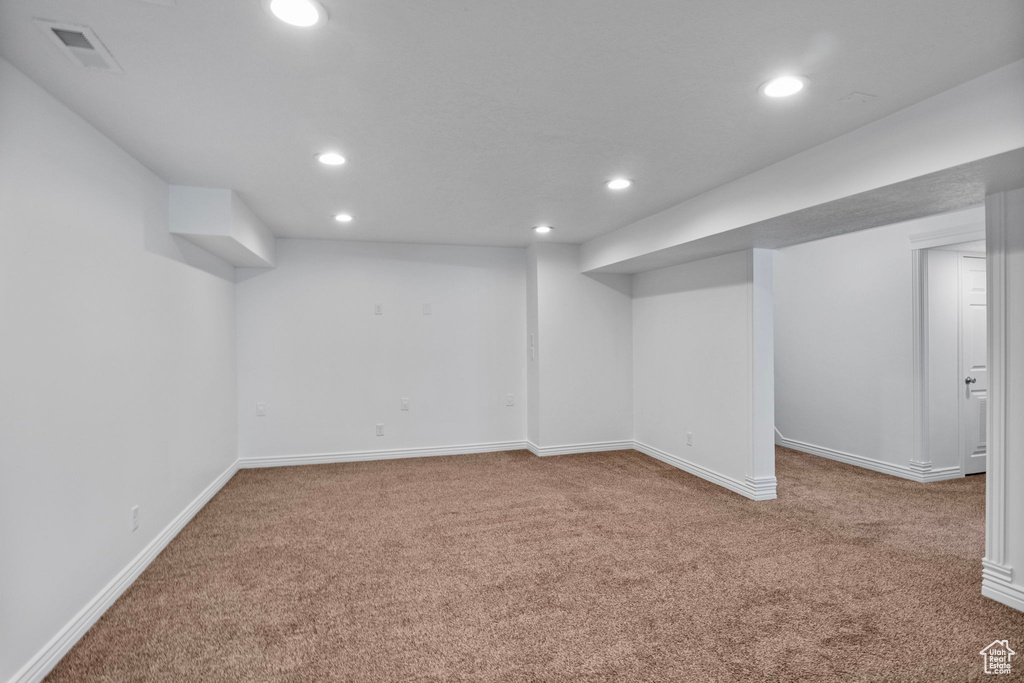 Finished basement with carpet, recessed lighting, and baseboards