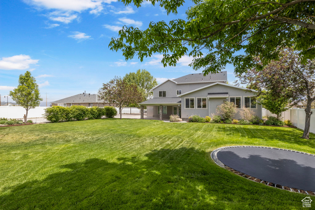 Rear view of property with stucco siding and a patio