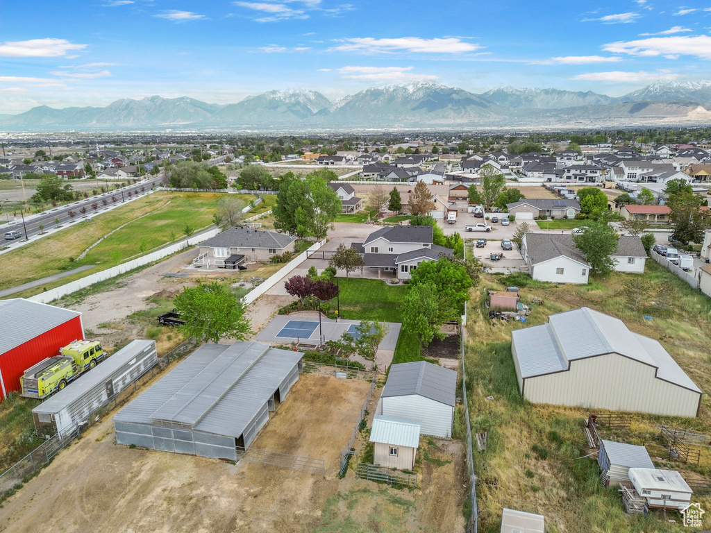 Aerial perspective of suburban area with a mountain backdrop
