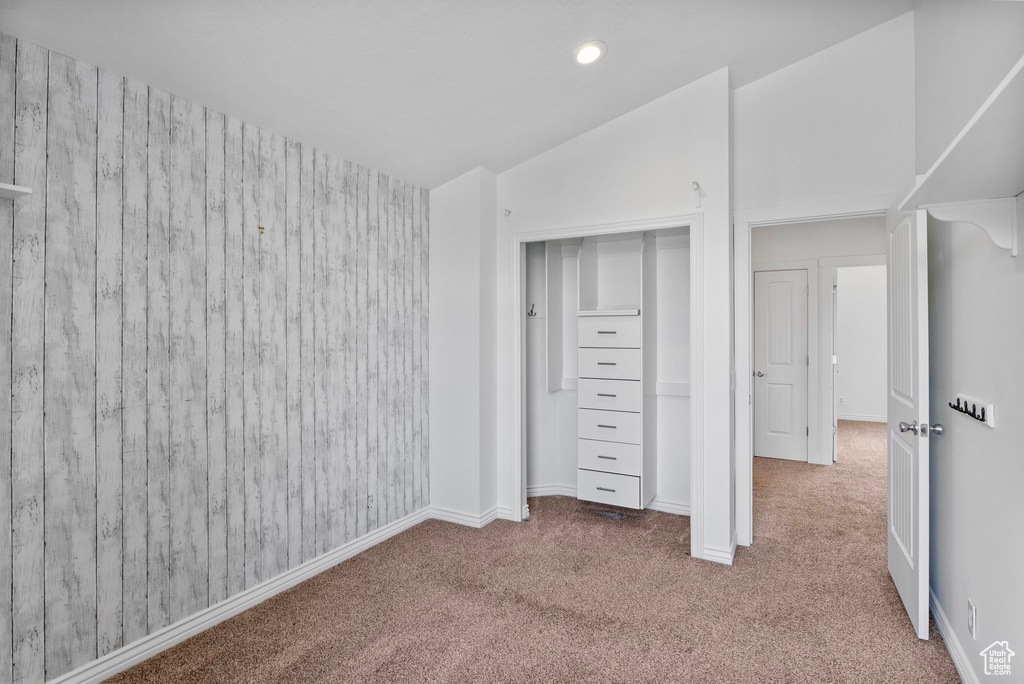 Unfurnished bedroom with carpet floors, lofted ceiling, recessed lighting, and baseboards