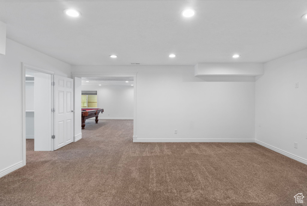 Finished below grade area featuring pool table, carpet, recessed lighting, and baseboards