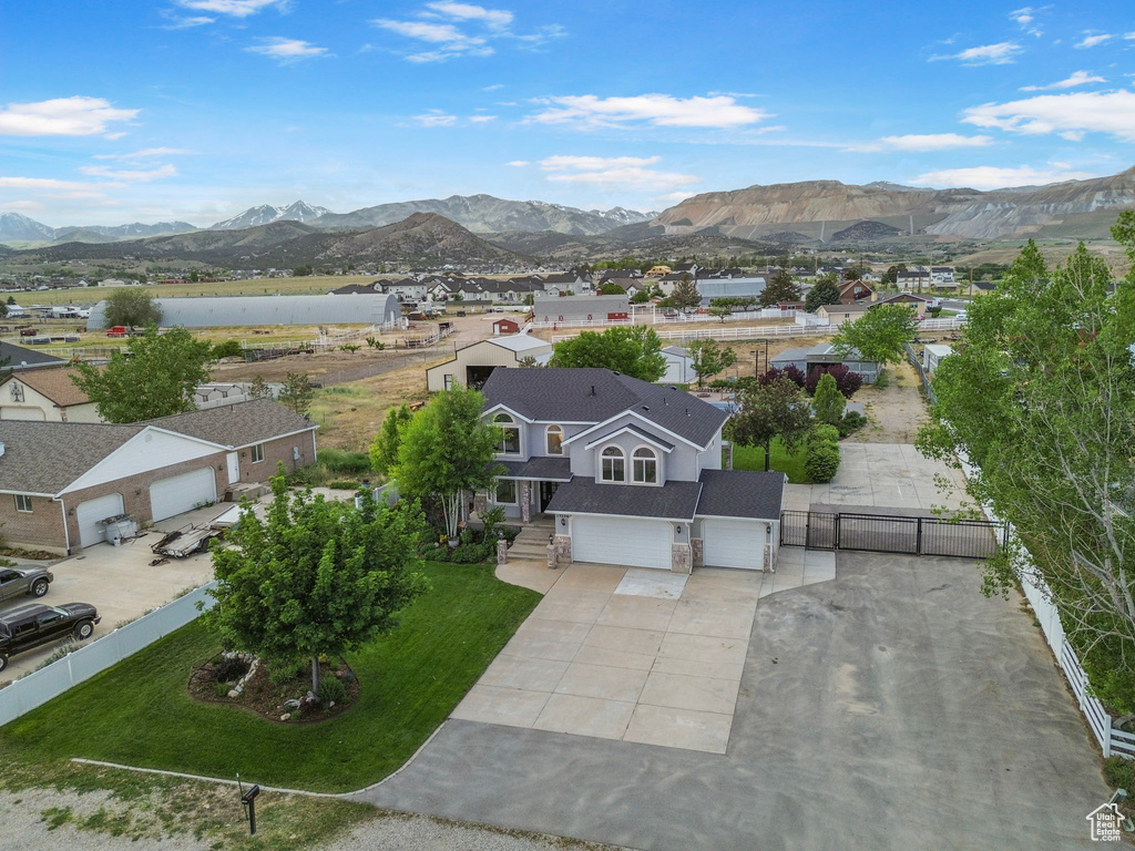 Aerial perspective of suburban area featuring a mountain backdrop