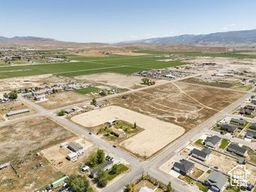 Aerial overview of property\'s location with a mountainous background