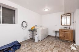 Laundry room with washing machine and dryer