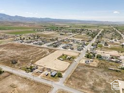Aerial overview of property\'s location featuring a mountain backdrop