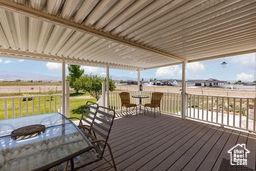 Wooden deck featuring outdoor dining space