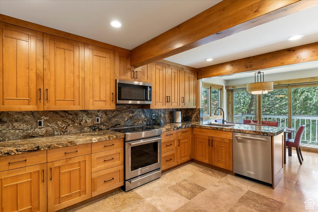 Kitchen with stainless steel appliances, a sink, decorative backsplash, recessed lighting, and beamed ceiling