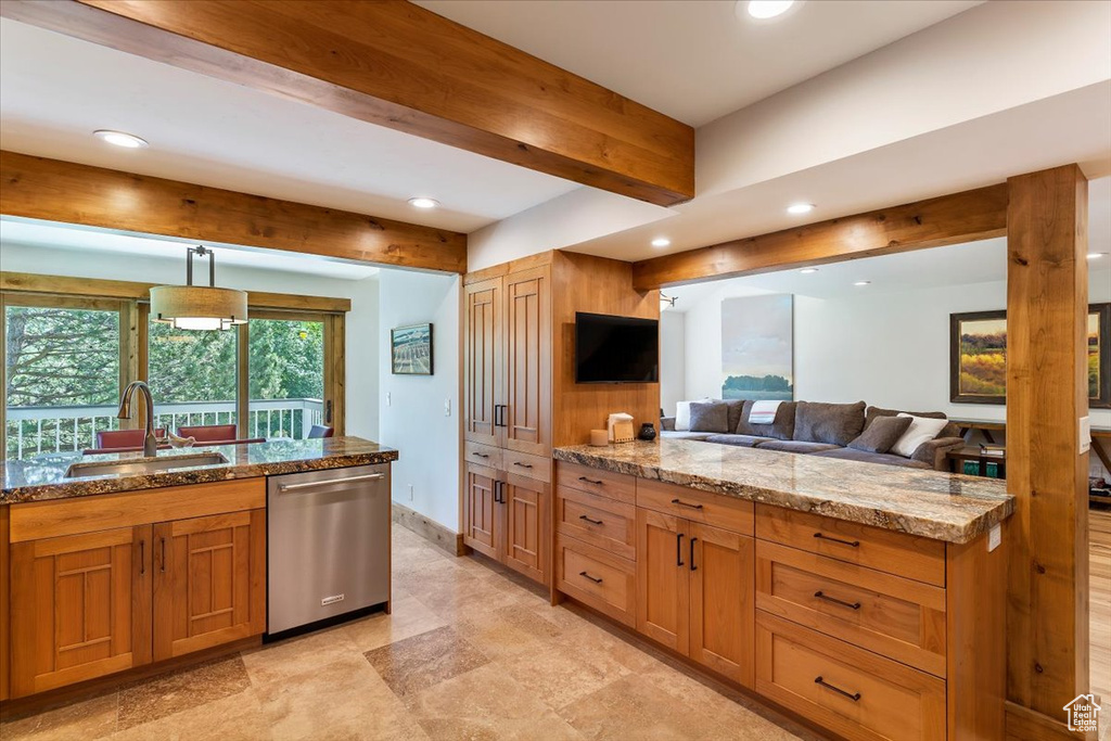 Kitchen featuring stainless steel dishwasher, recessed lighting, a sink, light stone counters, and beam ceiling
