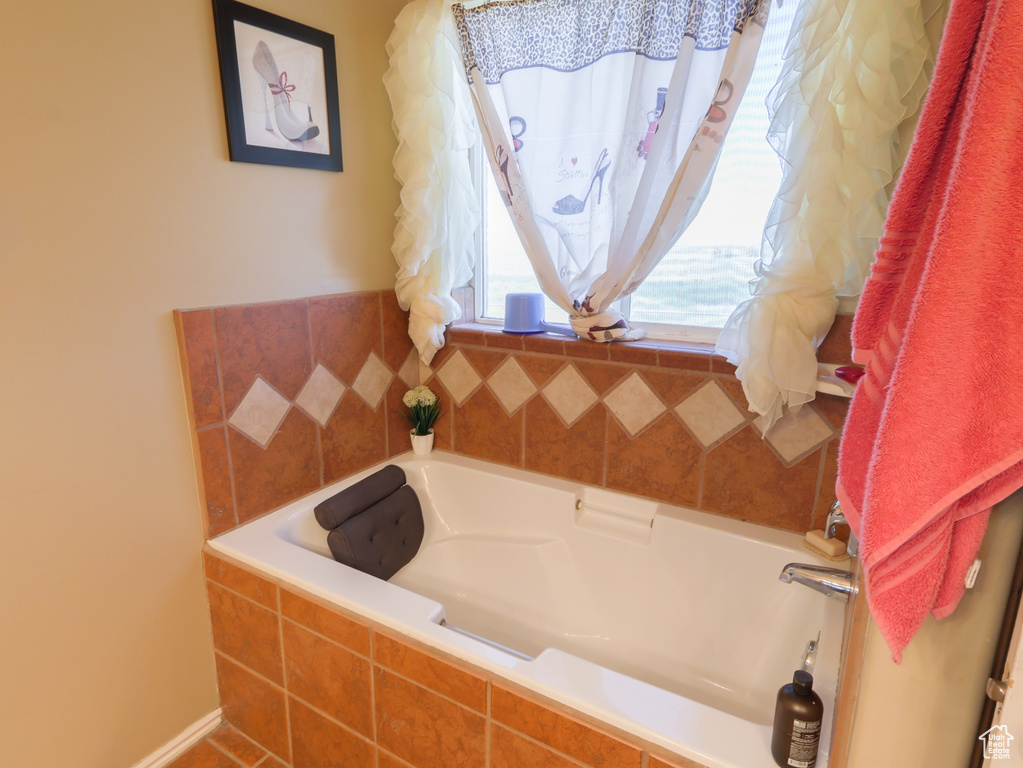 Full bath featuring a garden tub