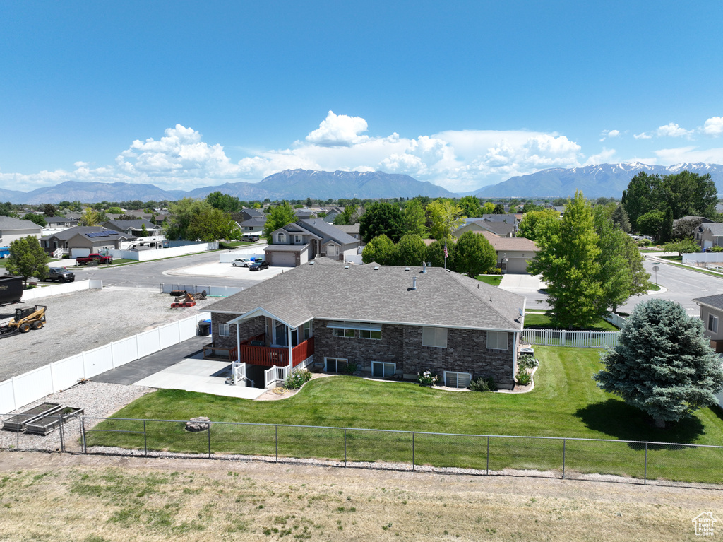 Aerial perspective of suburban area featuring a mountainous background