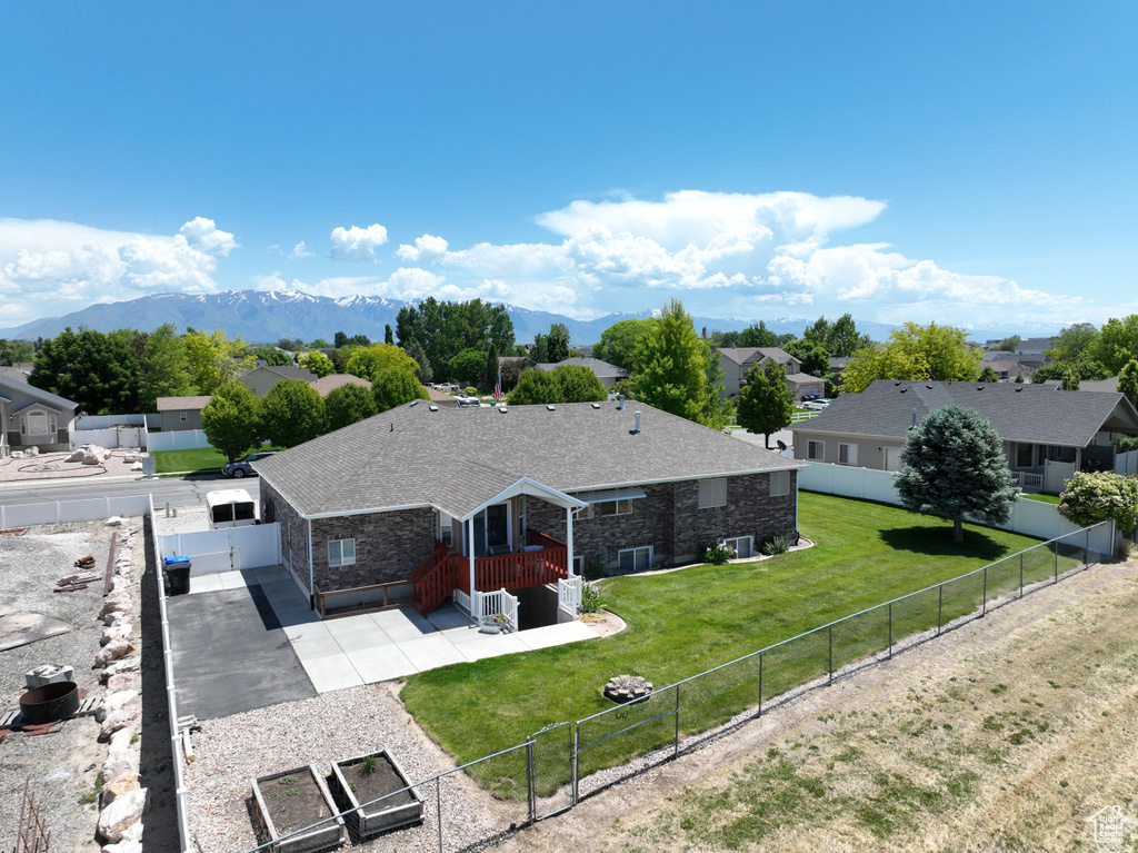Aerial perspective of suburban area with a mountain backdrop