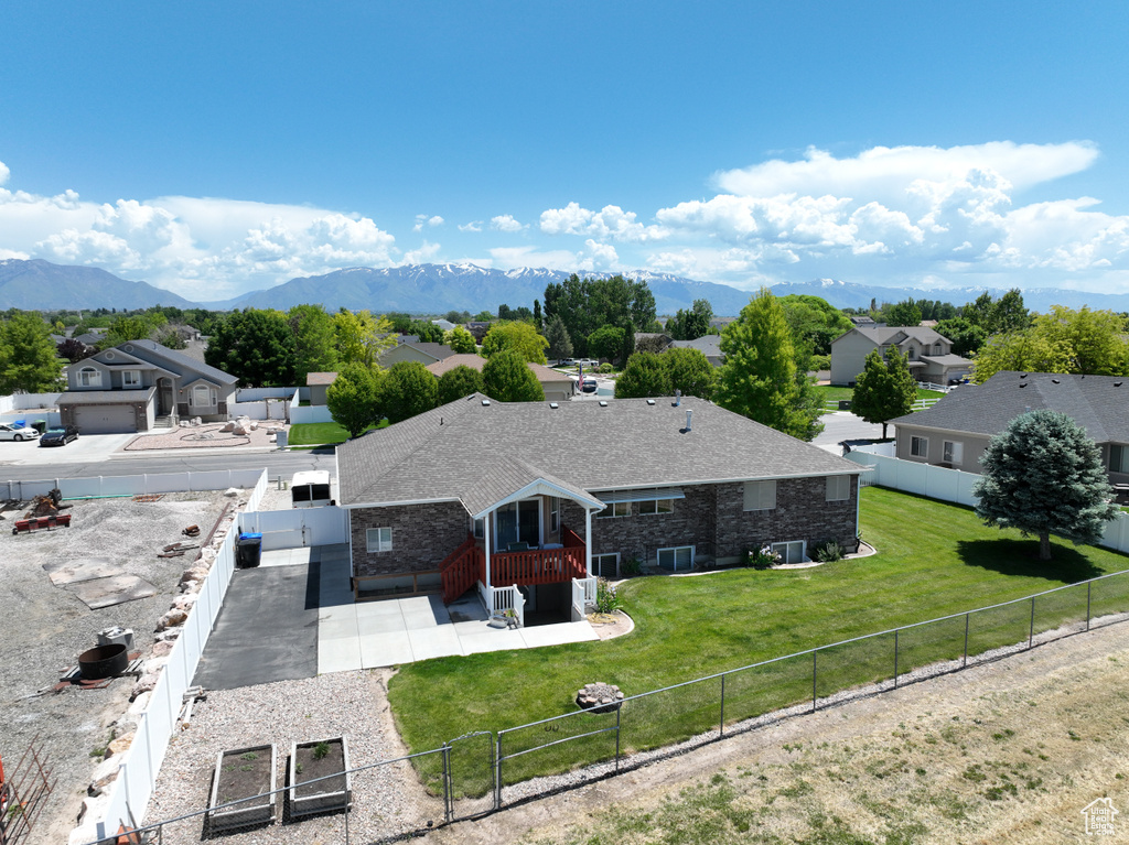 Aerial perspective of suburban area with a mountainous background