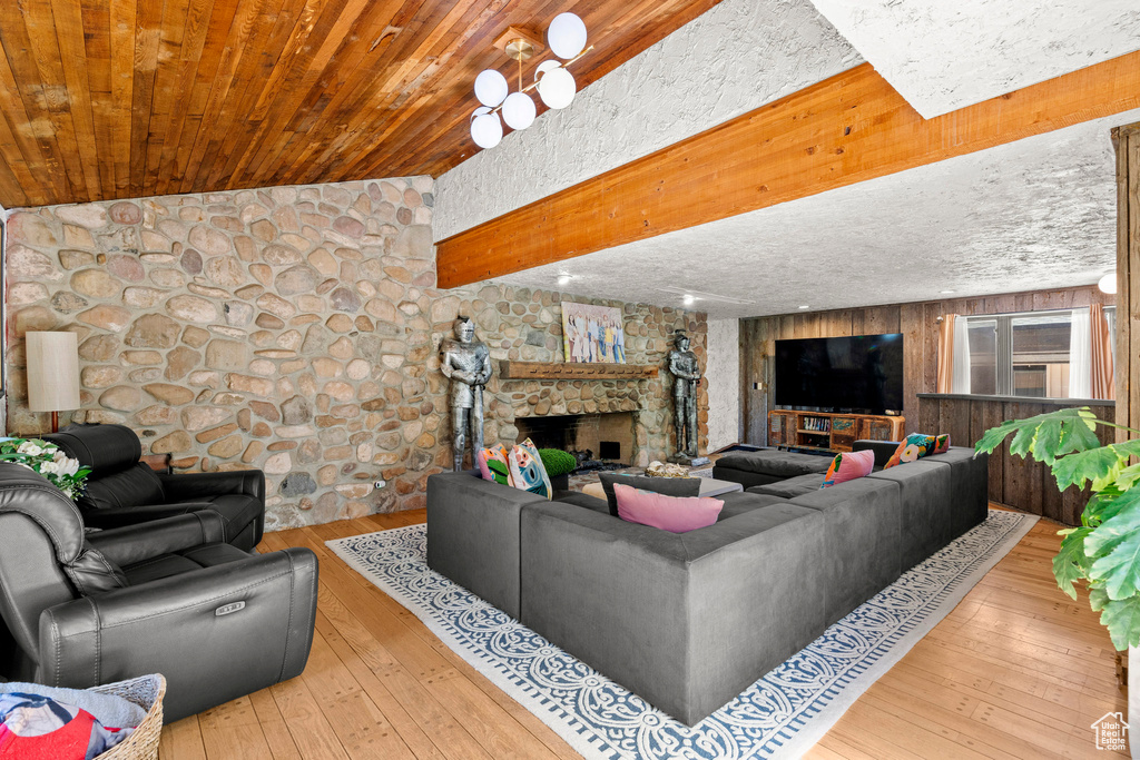 Living area with a fireplace and hardwood / wood-style floors