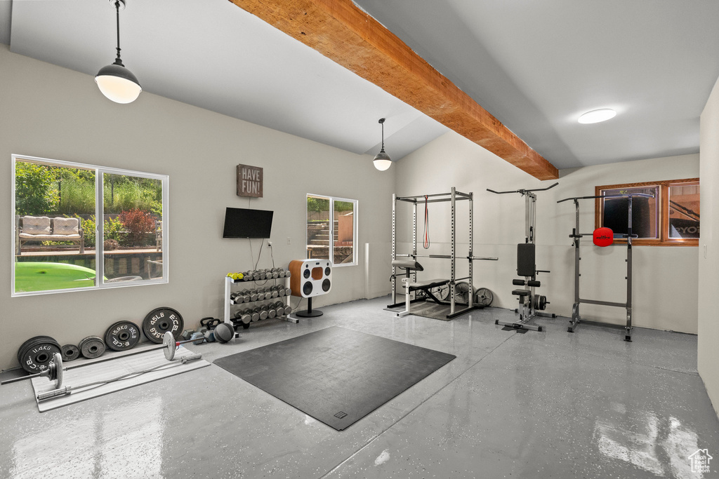 Workout room with vaulted ceiling