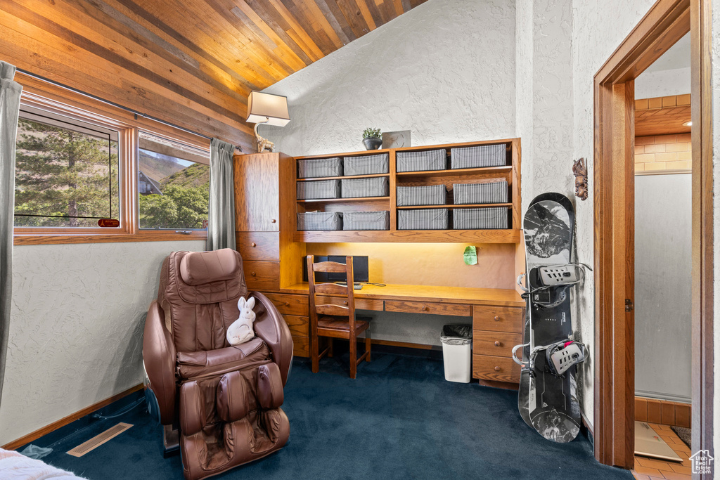 Office featuring a textured wall, wood ceiling, lofted ceiling, and dark colored carpet