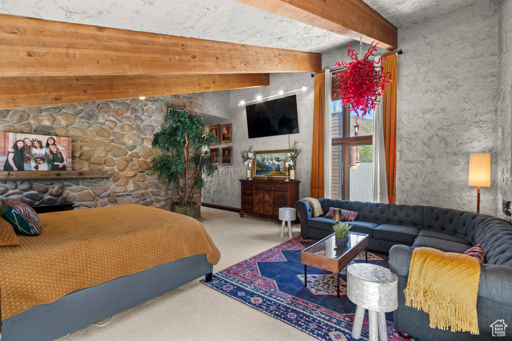 Carpeted bedroom with a fireplace