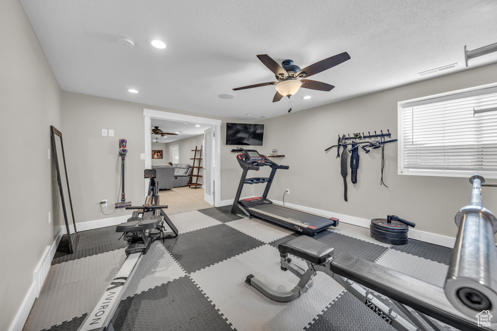 Workout room with a ceiling fan, recessed lighting, and baseboards