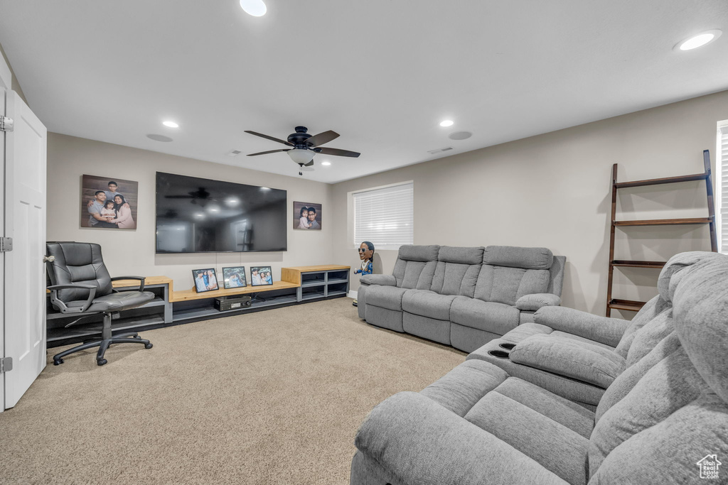 Living area featuring carpet floors, recessed lighting, and ceiling fan