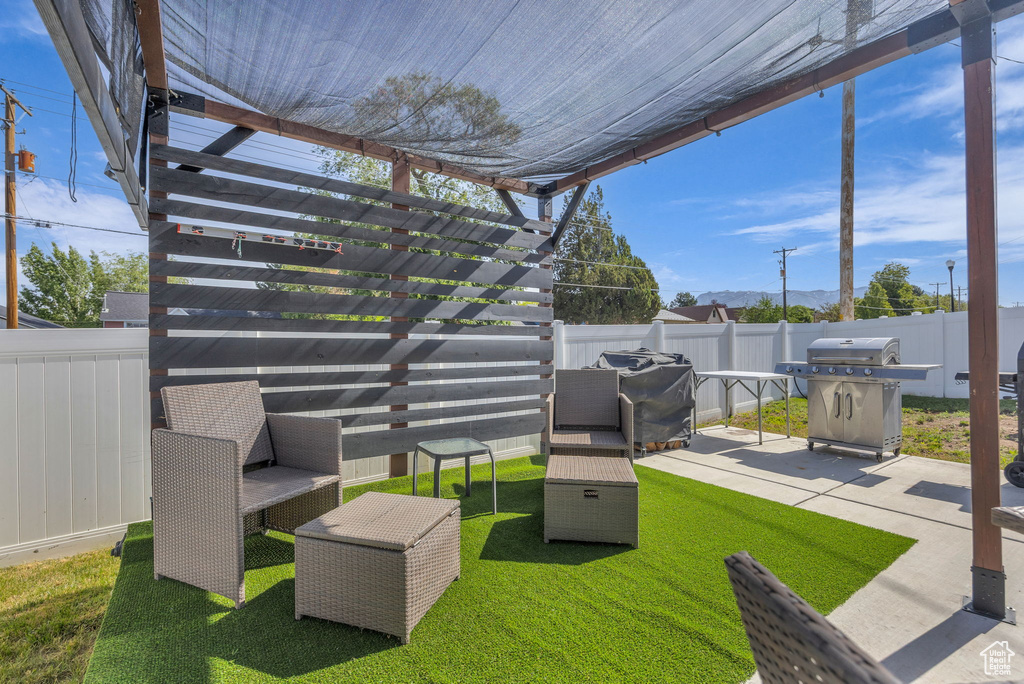 View of yard featuring a pergola and a patio