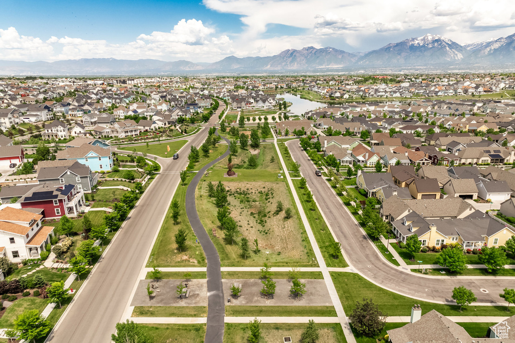 Aerial perspective of suburban area featuring a mountainous background
