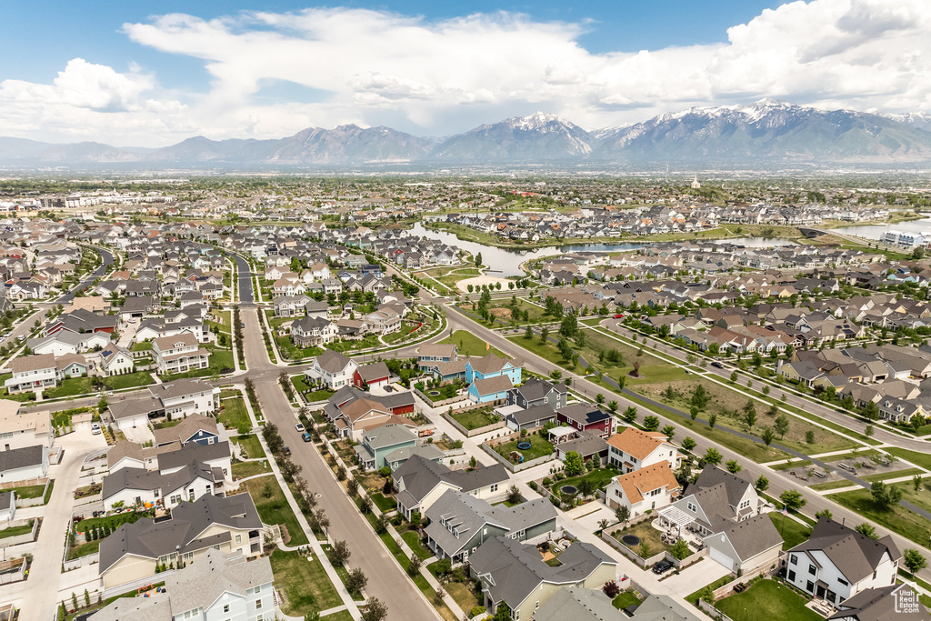 View of property location featuring nearby suburban area and a water and mountain view